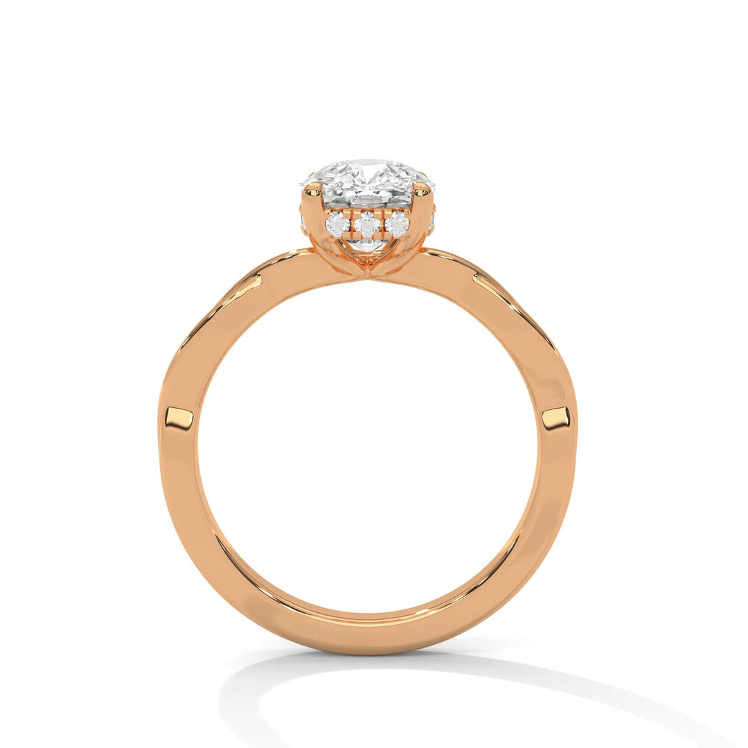 A rose gold engagement ring adorned with a cushion cut diamond center, featuring the elegant Kosina setting for added charm.