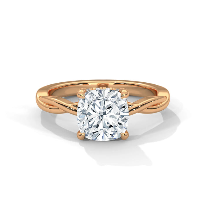 A stunning 14k rose gold engagement ring with a cushion cut diamond, beautifully crafted in the Kosina setting.