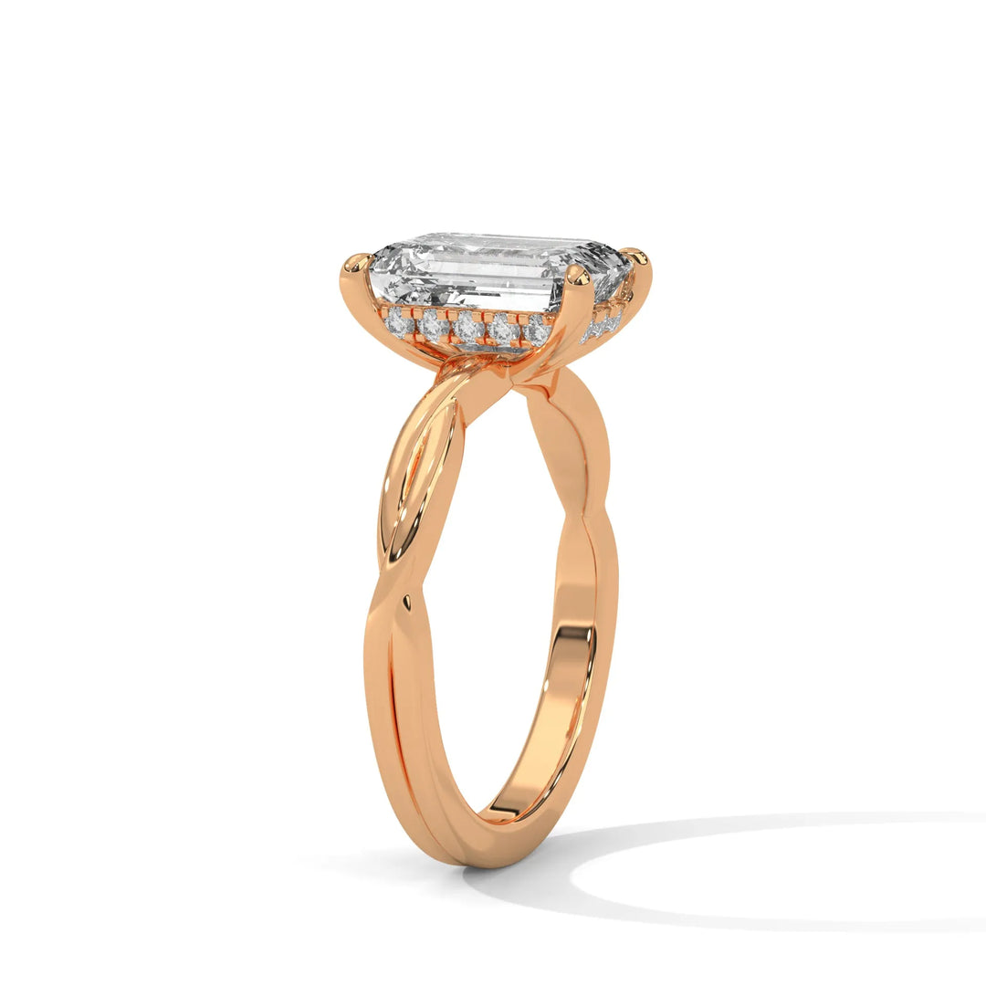 A rose gold engagement ring adorned with a emerald cut diamond center, exemplifying the refined Kosina setting craftsmanship.