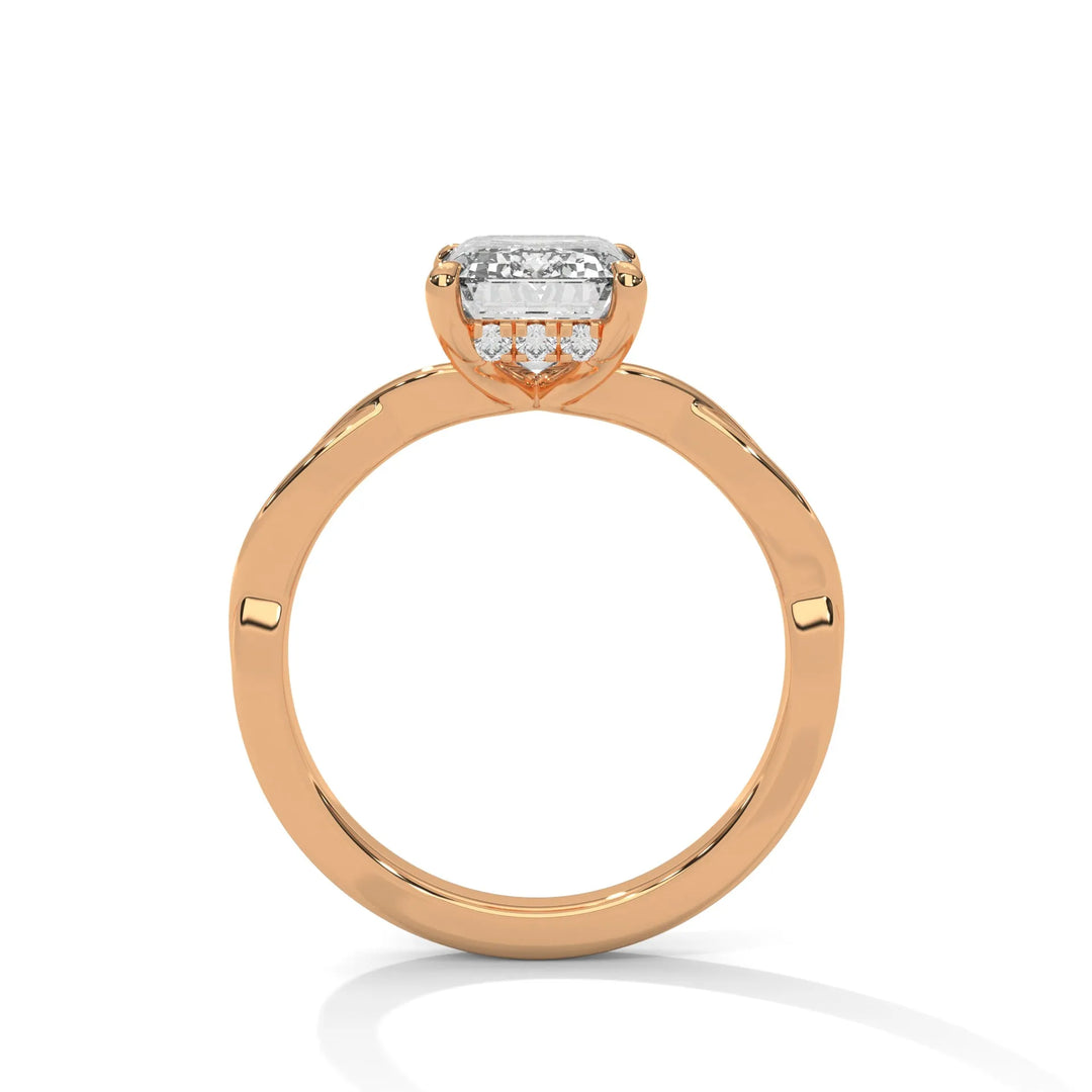 A rose gold engagement ring adorned with a emerald cut diamond center, featuring the elegant Kosina setting for added charm.