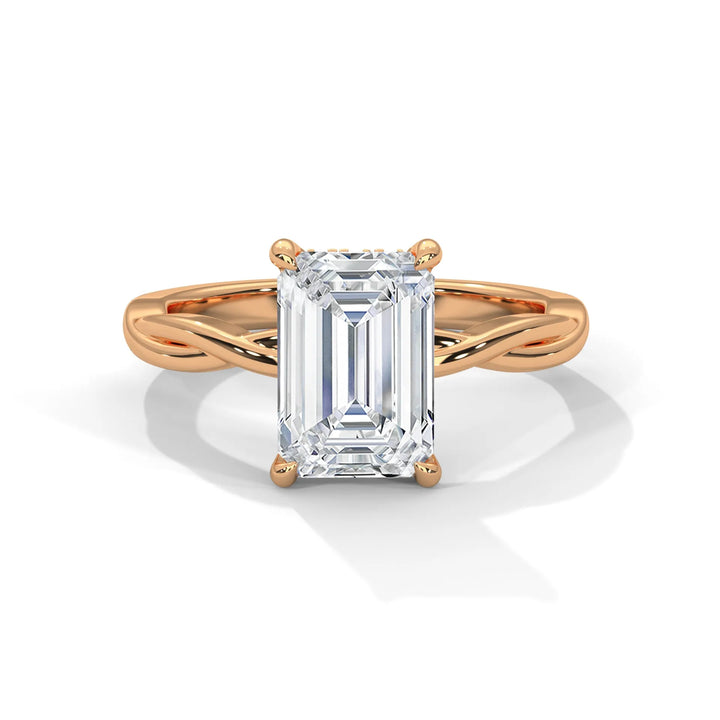 A stunning 14k rose gold engagement ring with a emerald cut diamond, beautifully crafted in the Kosina setting.