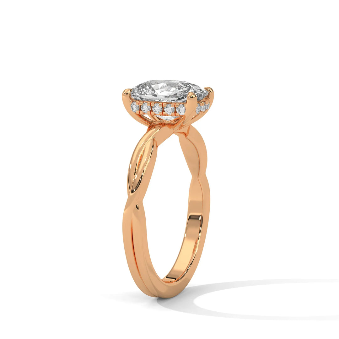 A rose gold engagement ring adorned with a long cushion cut diamond center, exemplifying the refined Kosina setting craftsmanship.