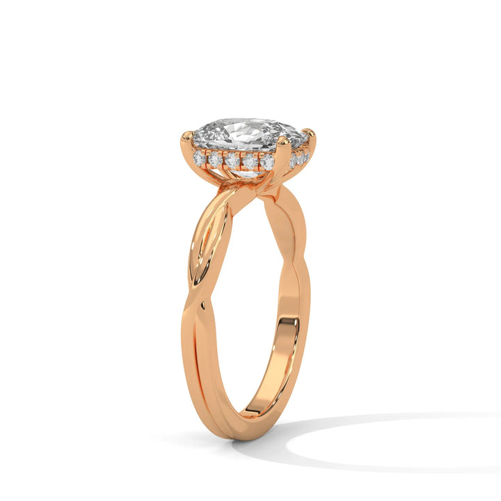 A rose gold engagement ring adorned with a long cushion cut diamond center, exemplifying the refined Kosina setting craftsmanship.