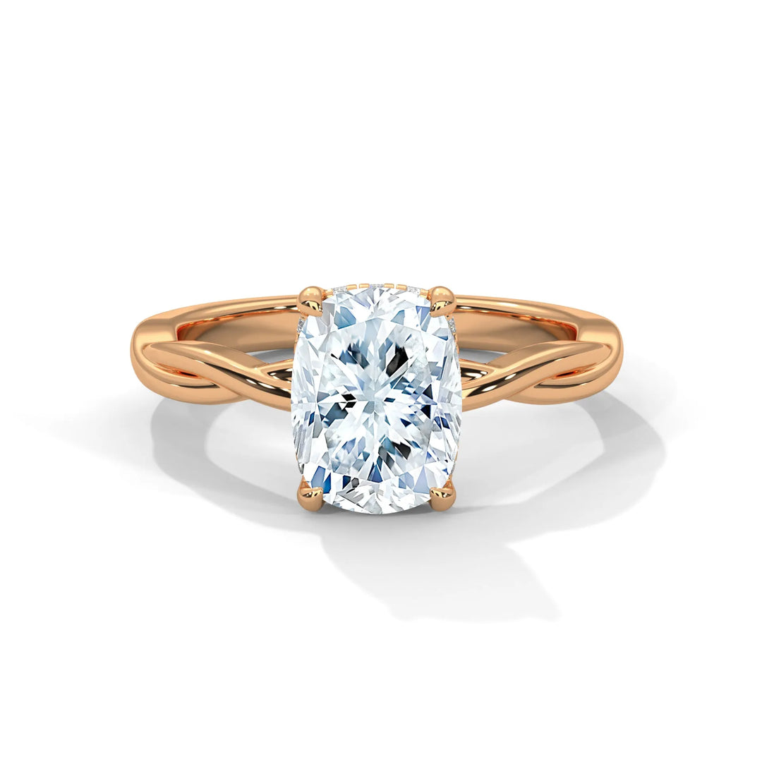 A stunning 14k rose gold engagement ring with a long cushion cut diamond, beautifully crafted in the Kosina setting.