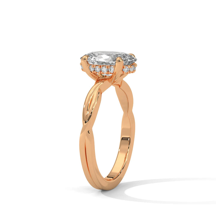 A rose gold engagement ring adorned with a oval cut diamond center, exemplifying the refined Kosina setting craftsmanship.