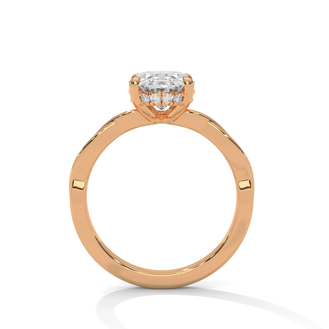 A rose gold engagement ring adorned with a oval cut diamond center, featuring the elegant Kosina setting for added charm.