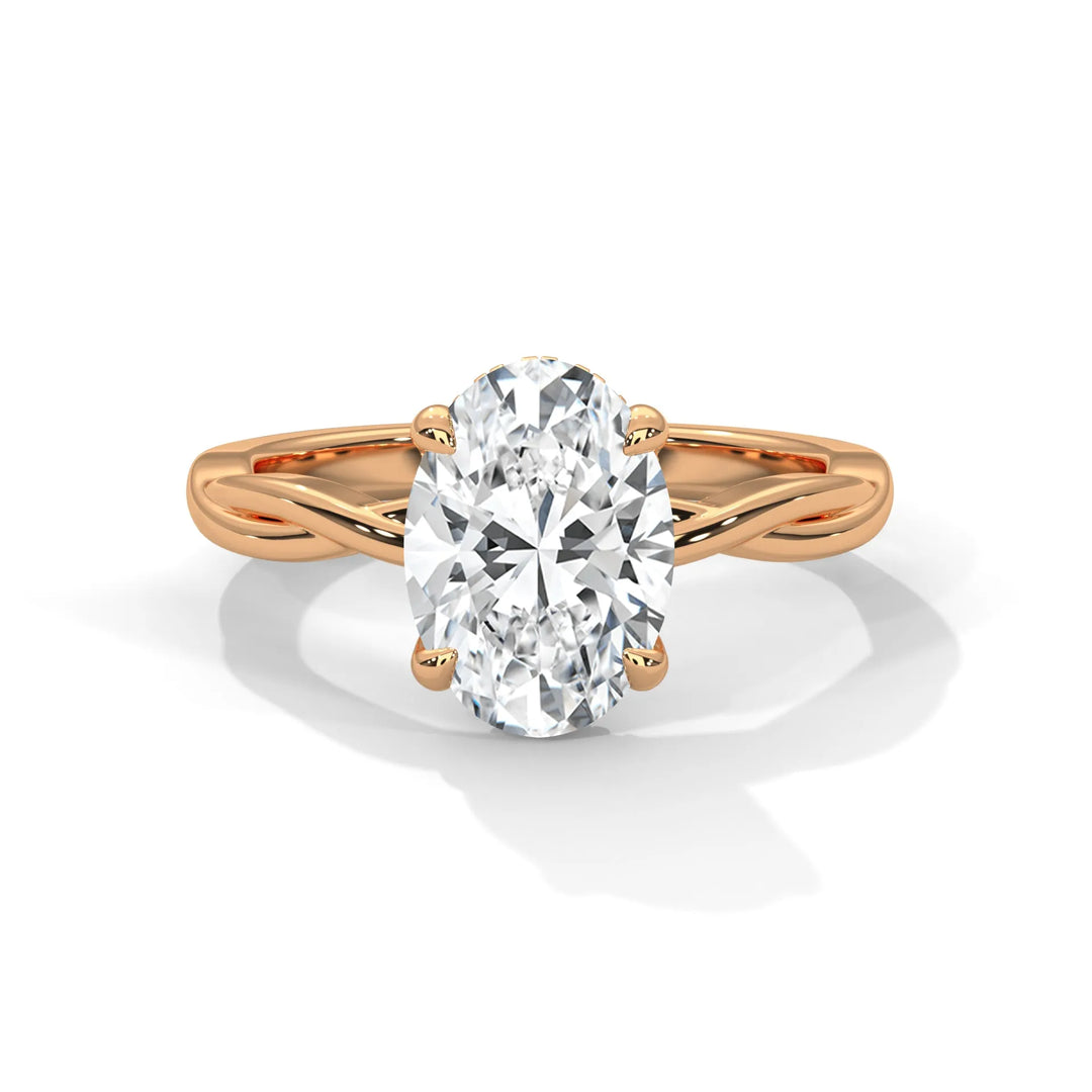 A stunning 14k rose gold engagement ring with a oval cut diamond, beautifully crafted in the Kosina setting.