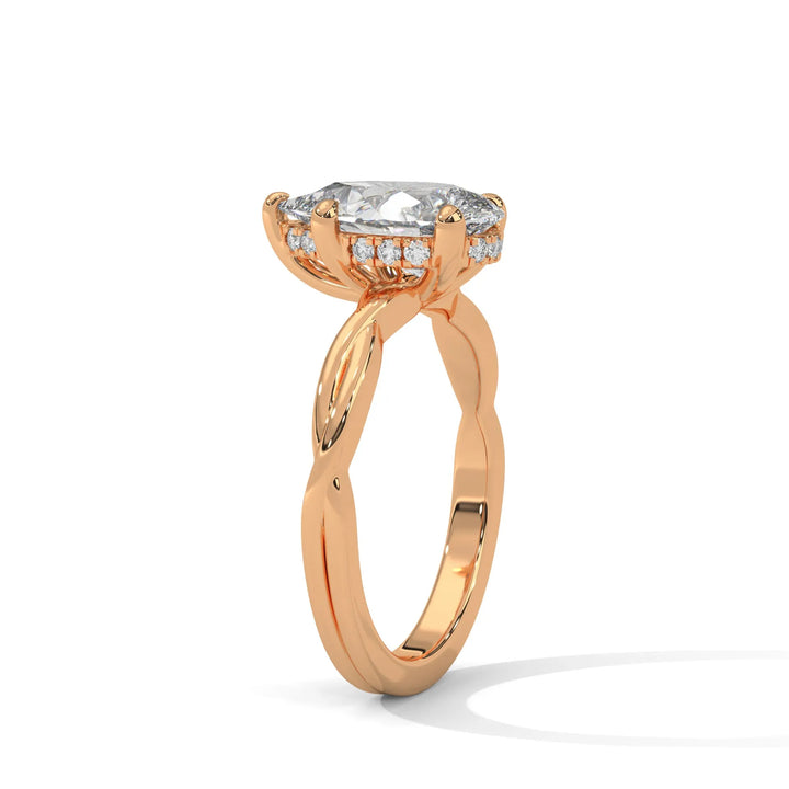 A rose gold engagement ring adorned with a pear cut diamond center, exemplifying the refined Kosina setting craftsmanship.