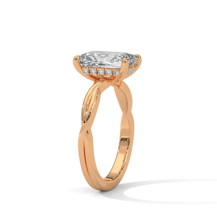 A rose gold engagement ring adorned with a radiant cut diamond center, exemplifying the refined Kosina setting craftsmanship.