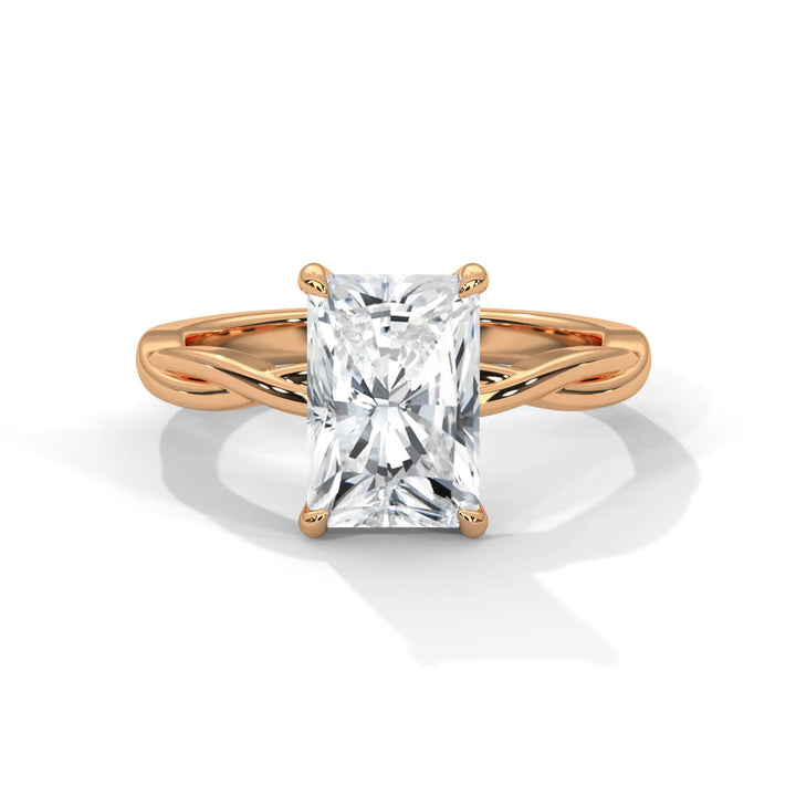 A stunning 14k rose gold engagement ring with a radiant cut diamond, beautifully crafted in the Kosina setting.