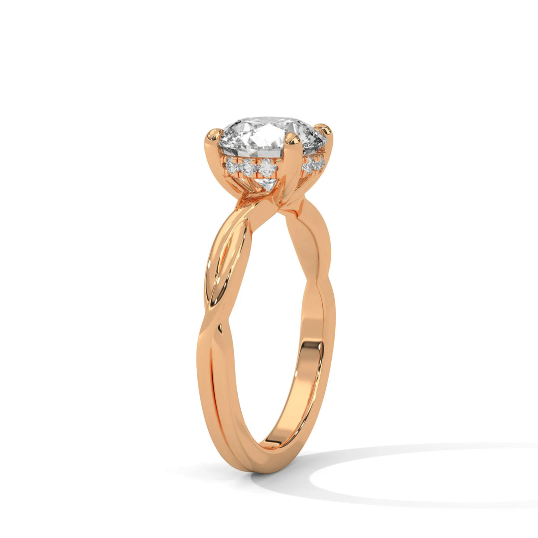 A rose gold engagement ring adorned with a round cut diamond center, exemplifying the refined Kosina setting craftsmanship.