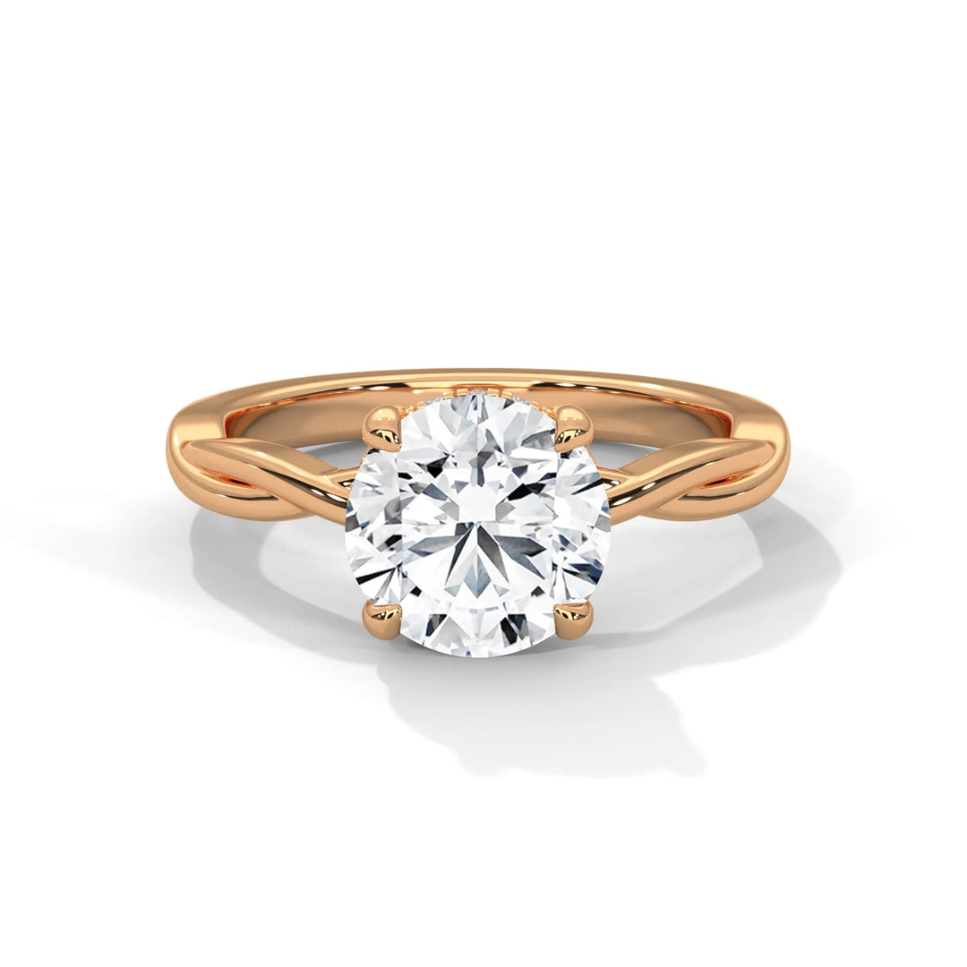 A stunning 14k rose gold engagement ring with a round cut diamond, beautifully crafted in the Kosina setting.