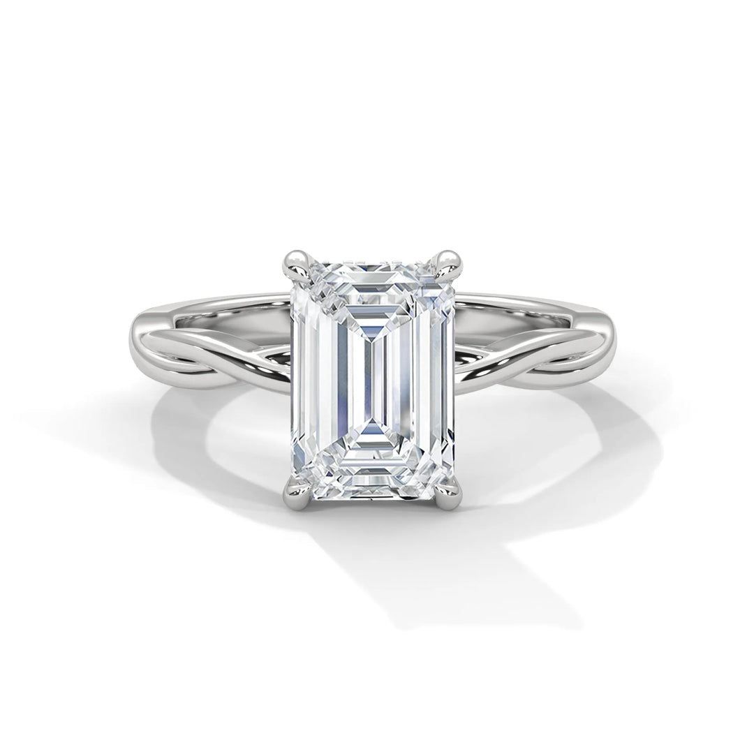 A stunning 14k white gold engagement ring with a emerald cut diamond, beautifully crafted in the Kosina setting.