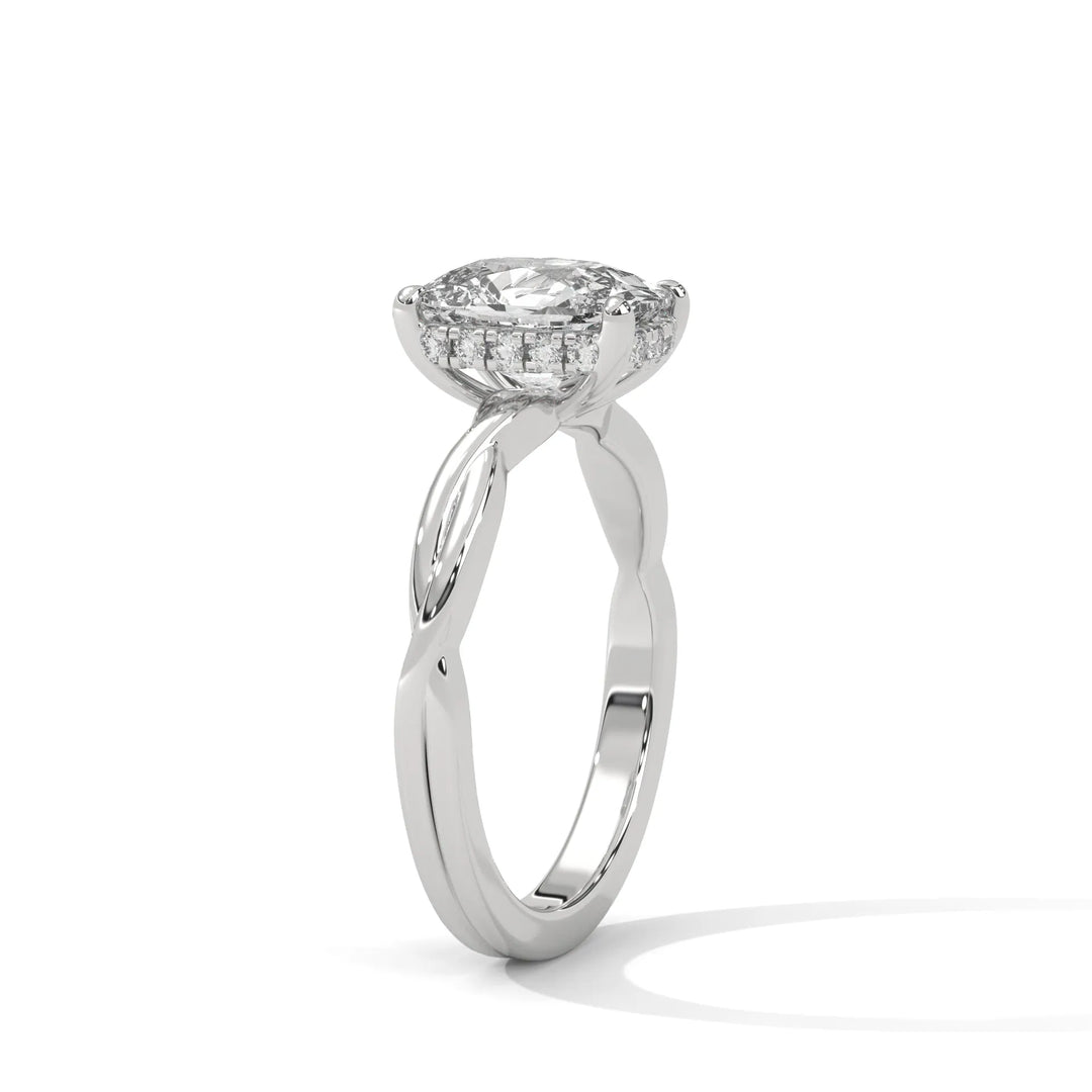 A white gold engagement ring adorned with a long cushion cut diamond center, exemplifying the refined Kosina setting craftsmanship.