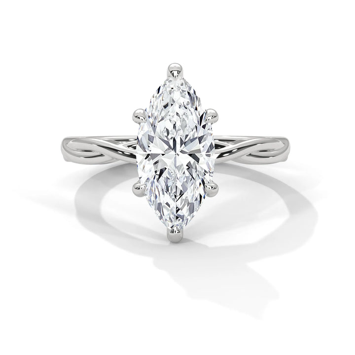 A stunning 14k white gold engagement ring with a marquise cut diamond, beautifully crafted in the Kosina setting.