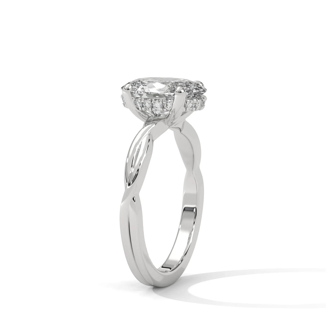 A white gold engagement ring adorned with a oval cut diamond center, exemplifying the refined Kosina setting craftsmanship.