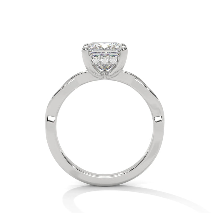 A white gold engagement ring adorned with a princess cut diamond center, featuring the elegant Kosina setting for added charm.