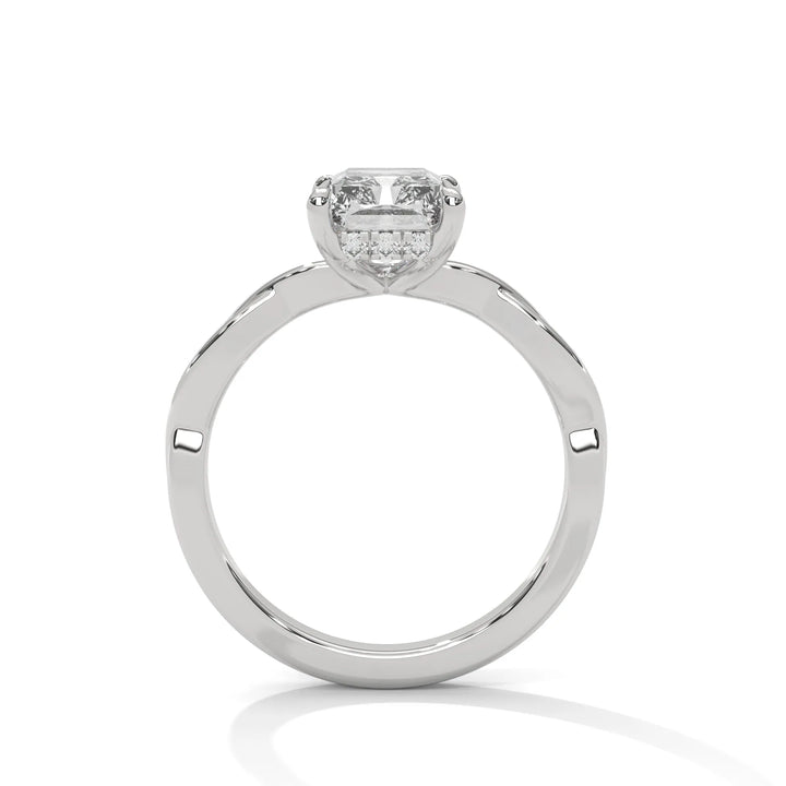 A white gold engagement ring adorned with a radiant cut diamond center, featuring the elegant Kosina setting for added charm.