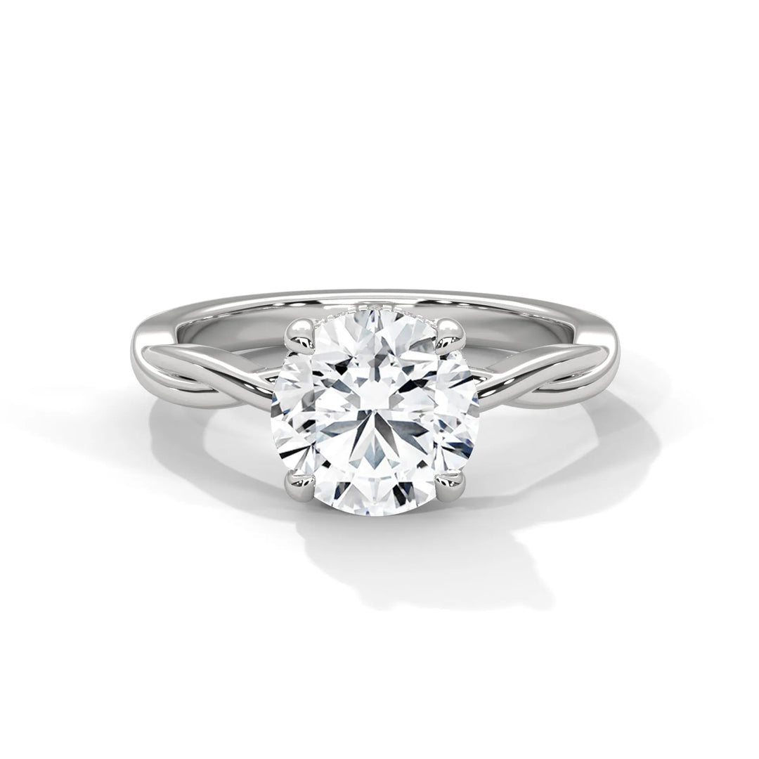 A stunning 14k white gold engagement ring with a round cut diamond, beautifully crafted in the Kosina setting.