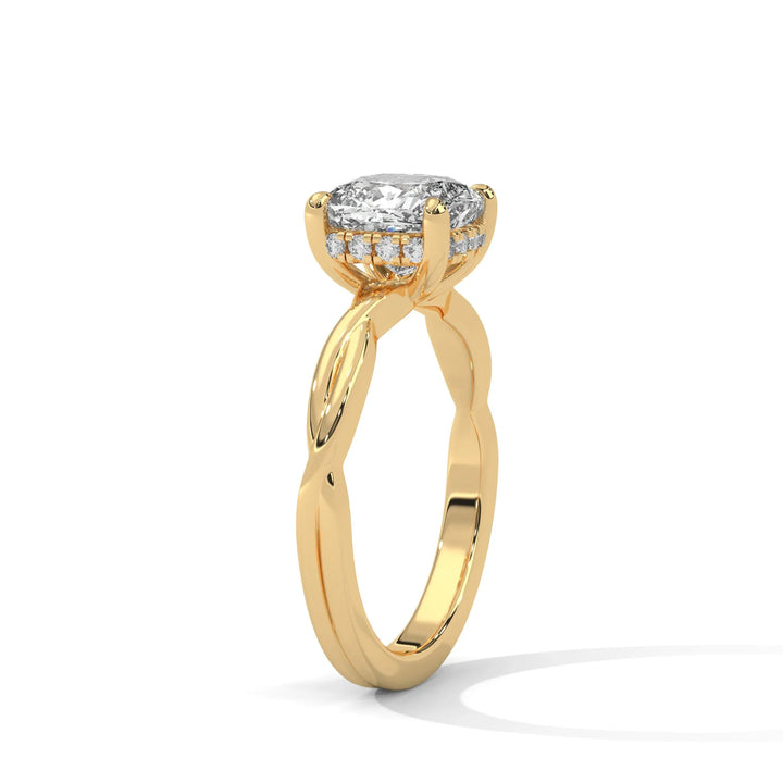 A yellow gold engagement ring adorned with a cushion cut diamond center, exemplifying the refined Kosina setting craftsmanship.