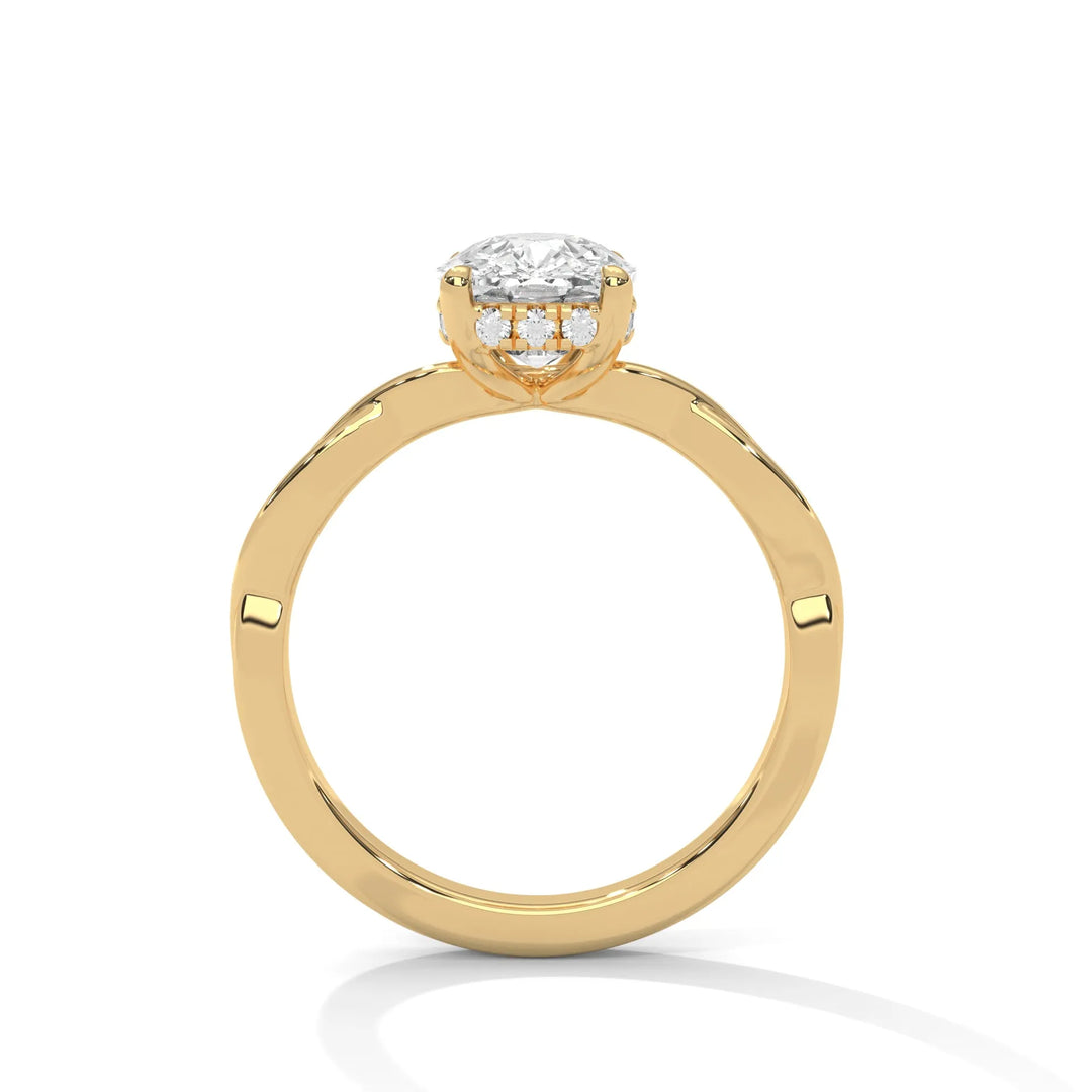 A yellow gold engagement ring adorned with a cushion cut diamond center, featuring the elegant Kosina setting for added charm.