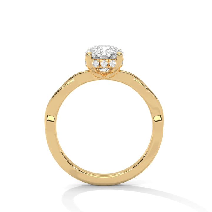 A yellow gold engagement ring adorned with a cushion cut diamond center, featuring the elegant Kosina setting for added charm.