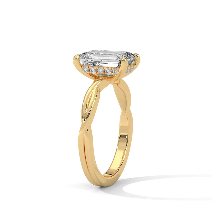 A yellow gold engagement ring adorned with a emerald cut diamond center, exemplifying the refined Kosina setting craftsmanship.