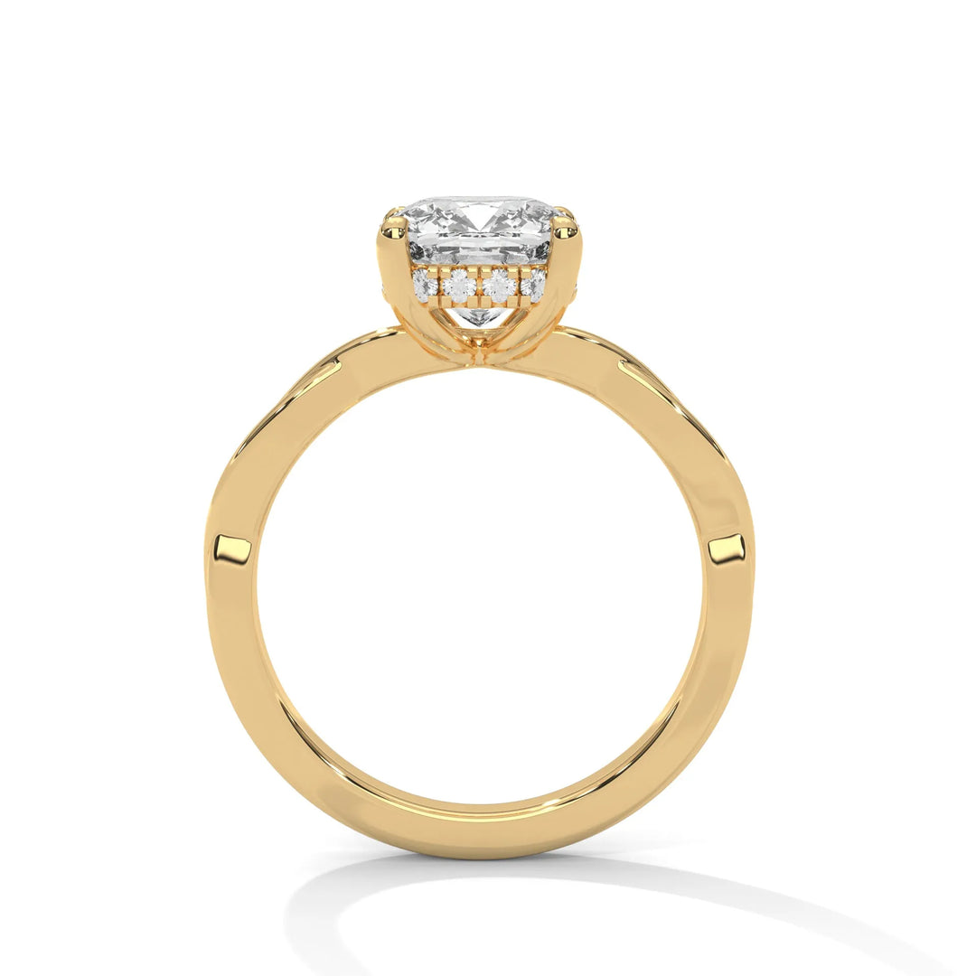 A yellow gold engagement ring adorned with a long cushion cut diamond center, featuring the elegant Kosina setting for added charm.