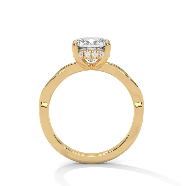 A yellow gold engagement ring adorned with a long cushion cut diamond center, featuring the elegant Kosina setting for added charm.