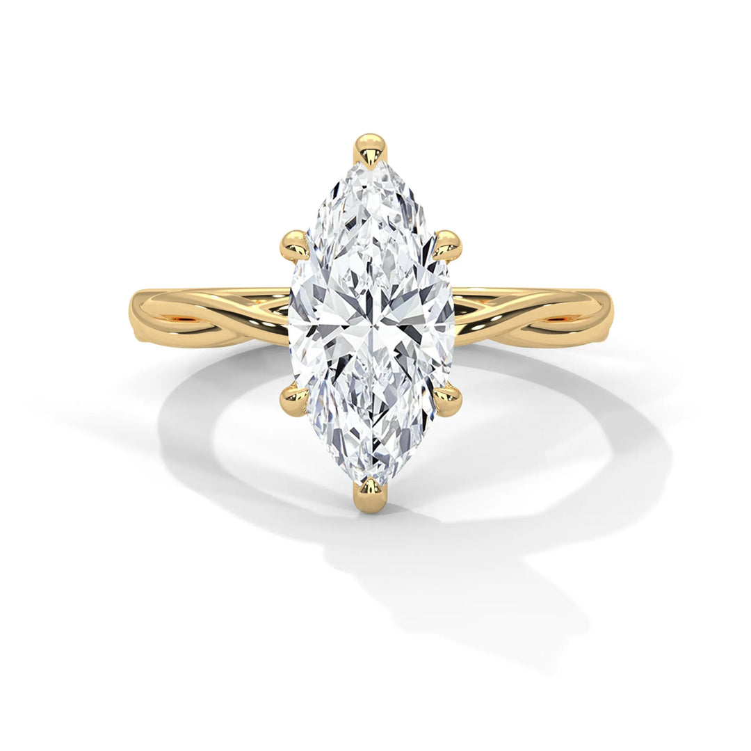 A stunning 14k yellow gold engagement ring with a marquise cut diamond, beautifully crafted in the Kosina setting.