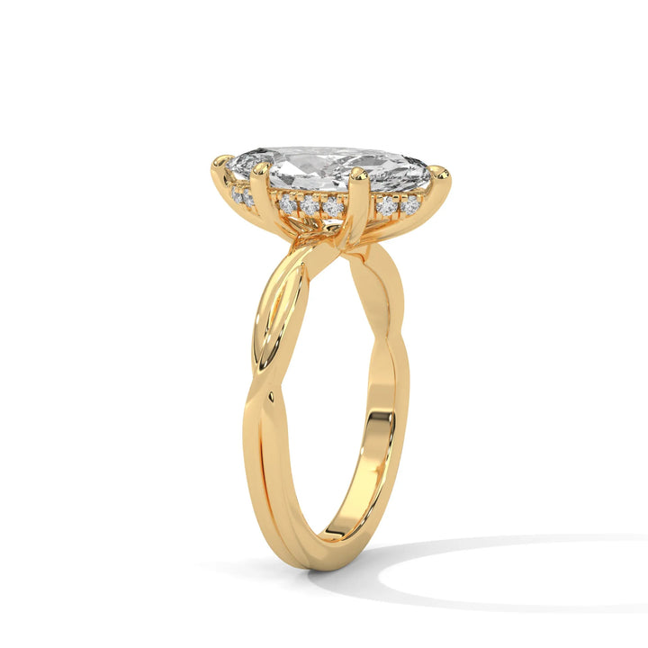 A yellow gold engagement ring adorned with a pear cut diamond center, exemplifying the refined Kosina setting craftsmanship.