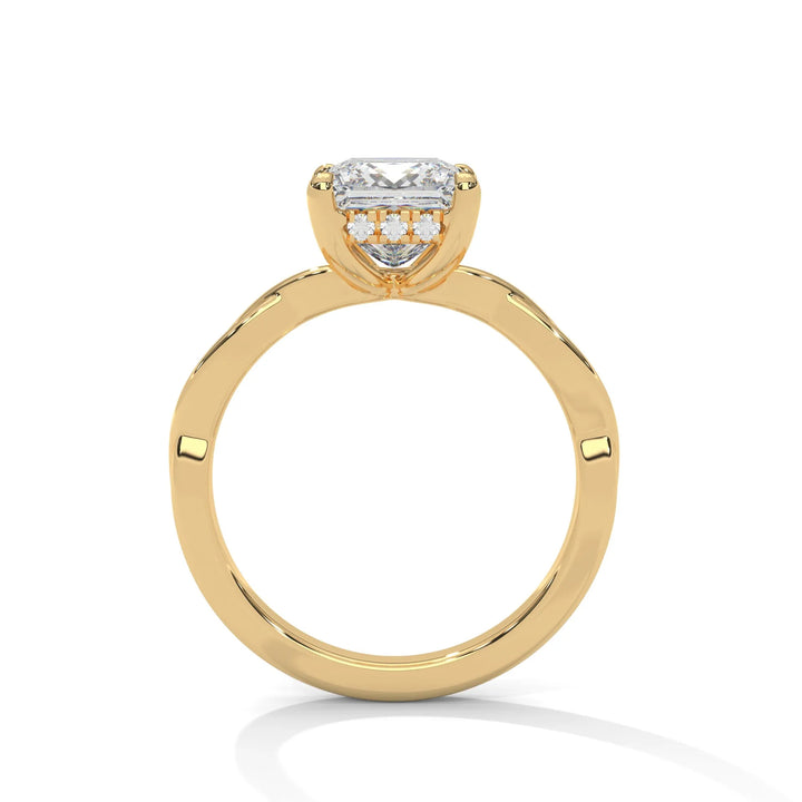 A yellow gold engagement ring adorned with a princess cut diamond center, featuring the elegant Kosina setting for added charm.