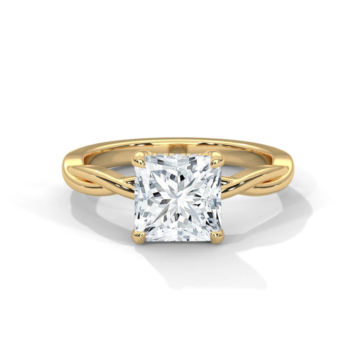 A stunning 14k yellow gold engagement ring with a princess cut diamond, beautifully crafted in the Kosina setting.