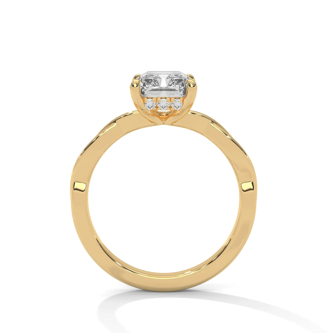 A yellow gold engagement ring adorned with a radiant cut diamond center, featuring the elegant Kosina setting for added charm.