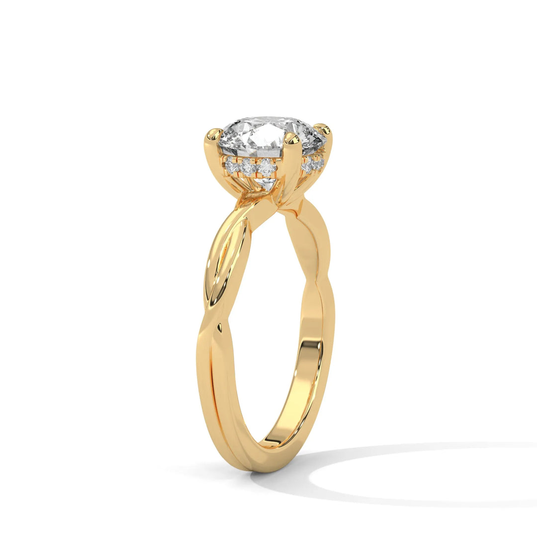 A yellow gold engagement ring adorned with a round cut diamond center, exemplifying the refined Kosina setting craftsmanship.