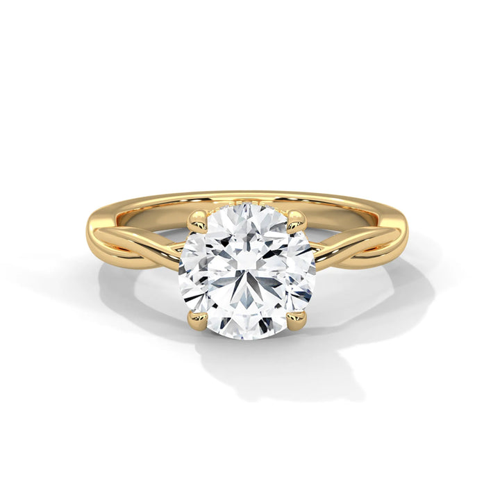 A stunning 14k yellow gold engagement ring with a round cut diamond, beautifully crafted in the Kosina setting.