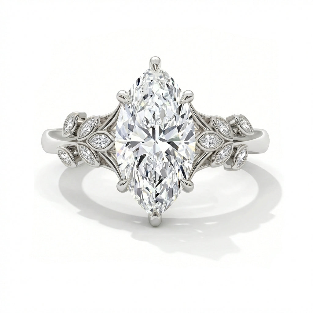 Marquise cut diamond engagement ring in 14k white gold with nature inspired floral leaf setting and pave diamond accents