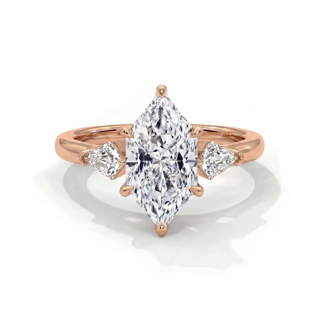 A marquise-cut diamond ring with rose gold band, featuring two triangular side diamonds. The elegant design conveys luxury and sophistication.