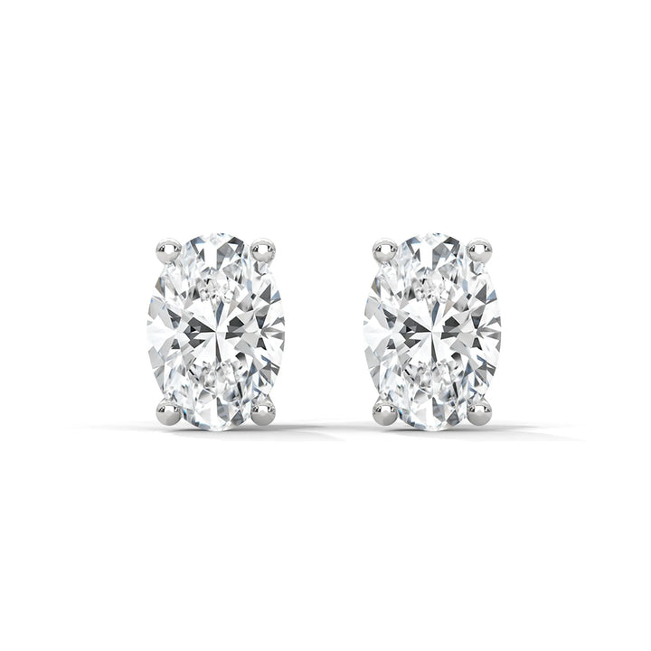 Oval cut diamond stud earrings on a white background.