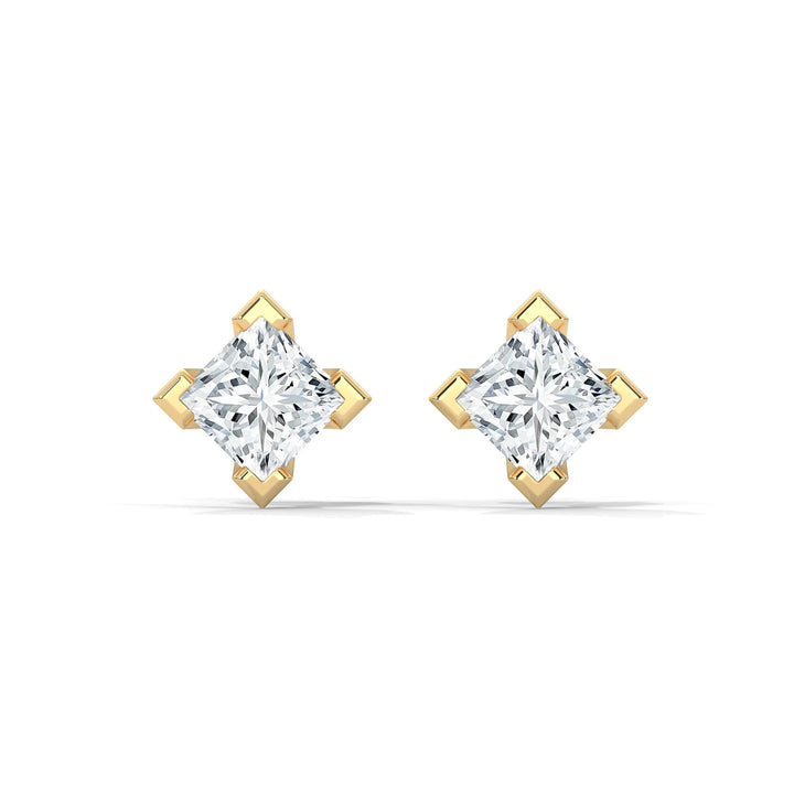 Pair of diamond earrings with gold settings on a white background.