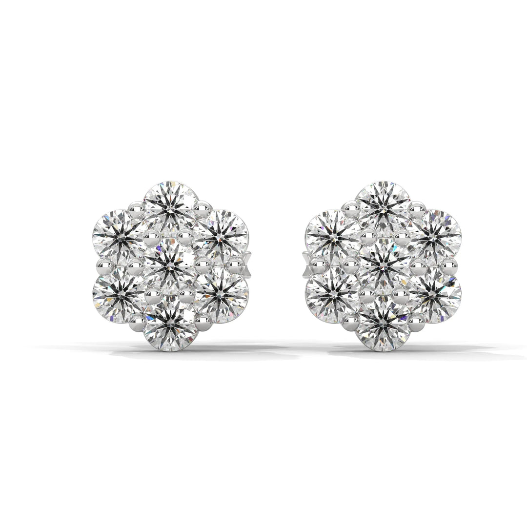 Pair of diamond flower shaped stud earrings on a white background.