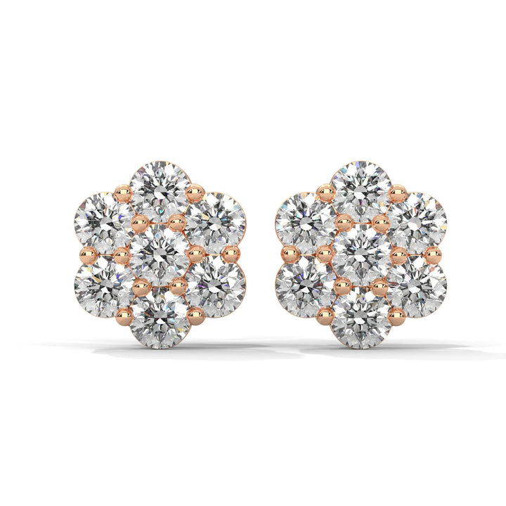 Pair of flower shaped diamond earrings with rose gold setting on a white background.