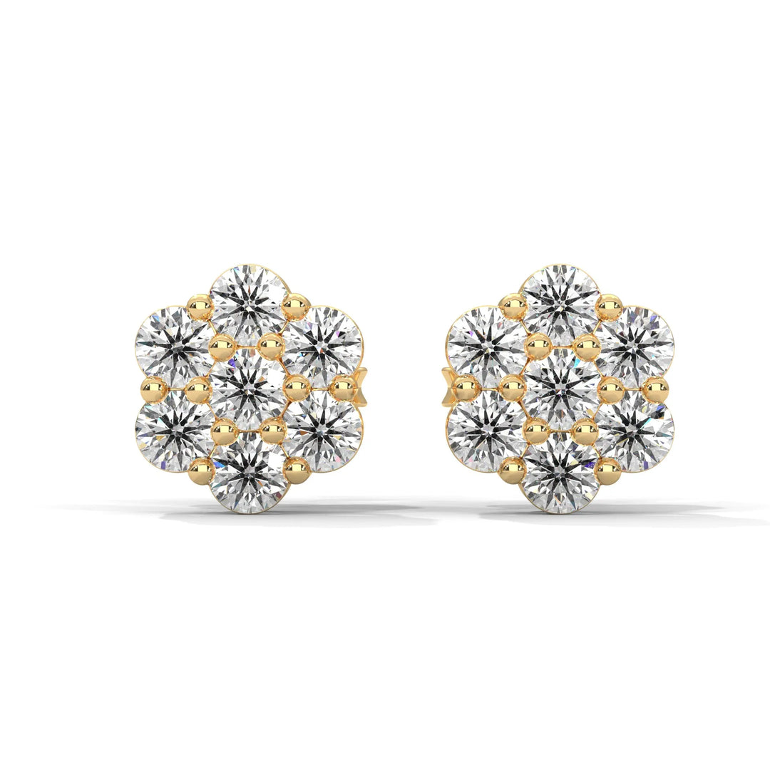 A pair of gold and diamond flower shaped stud earrings on a white background.