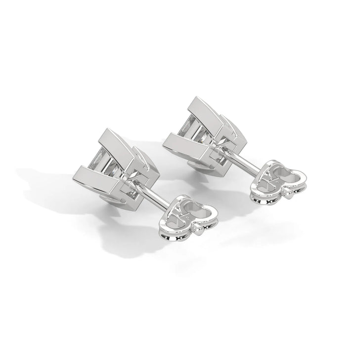 Pair of silver cufflinks on a white background.