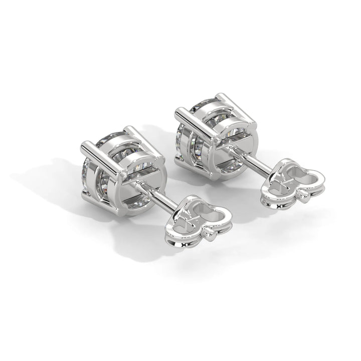 A pair of silver knot style cufflinks on a white background.