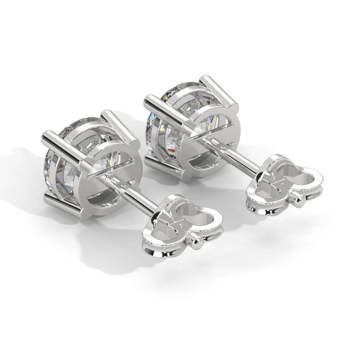 A pair of silver tone cufflinks with clear crystal details.