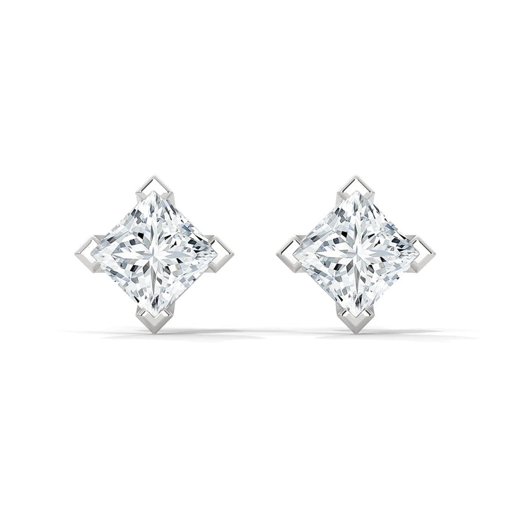 A pair of square cut diamond earrings set in white gold.