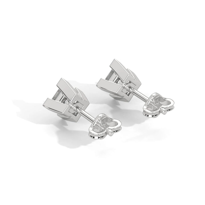 Pair of white gold cufflinks on a white background.