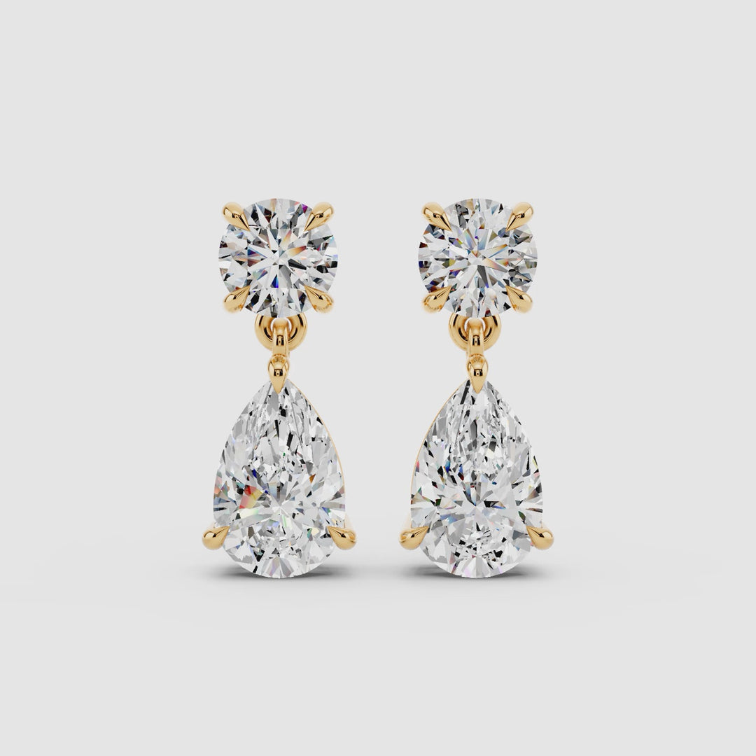 Rotating 360 view of 5ct lab grown diamond drop earrings in 14k yellow gold