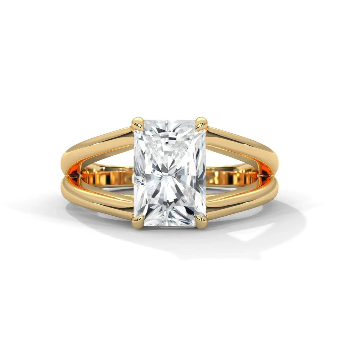 A radiant cut diamond ring in a yellow gold setting with a split band design. The diamond is elegantly showcased, reflecting light for a glamorous effect.